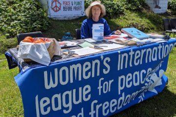 Judy Karas at WILPF table - Seaside Earth Day 4-28-19