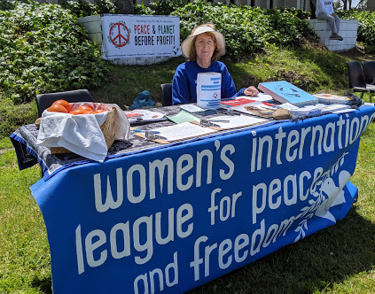 Judy Karas at WILPF table - Seaside Earth Day 4-28-19